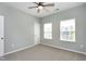 A well-lit bedroom features neutral walls, carpet flooring, and a ceiling fan at 3224 Wishing Well Wynd, Apex, NC 27502