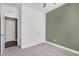 Minimalist bedroom featuring neutral colors, a ceiling fan, and a spacious closet at 3224 Wishing Well Wynd, Apex, NC 27502