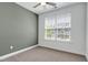 Neutral bedroom with a window and carpet floor at 3224 Wishing Well Wynd, Apex, NC 27502