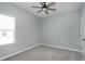 Carpeted bedroom features light-colored walls, neutral carpet, and a ceiling fan at 3224 Wishing Well Wynd, Apex, NC 27502