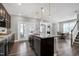 A bright kitchen with a large island, modern appliances, and an open layout at 3224 Wishing Well Wynd, Apex, NC 27502