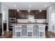 Updated kitchen with granite countertops, stainless steel appliances, and modern pendant lighting at 3224 Wishing Well Wynd, Apex, NC 27502
