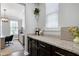 Stylish butler's pantry featuring granite countertops, dark cabinetry, and modern finishes at 3224 Wishing Well Wynd, Apex, NC 27502