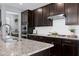 Beautiful kitchen with granite counters, stainless appliances, and a modern gas cooktop at 3224 Wishing Well Wynd, Apex, NC 27502