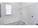 The laundry room features tiled floors, a window, and wire rack shelving at 3224 Wishing Well Wynd, Apex, NC 27502