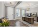 Inviting home office with natural light, a wooden desk, and elegant furniture at 3224 Wishing Well Wynd, Apex, NC 27502