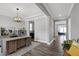 Bright home office with hardwood floors, modern lighting, and a spacious desk at 3224 Wishing Well Wynd, Apex, NC 27502