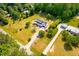 Aerial view of a charming home with a long driveway and green surroundings at 3281 Phillips Chapel Rd, Haw River, NC 27258