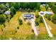 Expansive aerial view of a home featuring a well-maintained lawn and surrounding greenery at 3281 Phillips Chapel Rd, Haw River, NC 27258