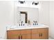 Bathroom features double sinks, modern faucets, and a large mirror at 3281 Phillips Chapel Rd, Haw River, NC 27258