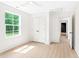 Bright bedroom features a ceiling fan, large window, and closet with double doors at 3281 Phillips Chapel Rd, Haw River, NC 27258