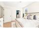 Bedroom showcasing large windows and a view to the bathroom, offering natural light at 3281 Phillips Chapel Rd, Haw River, NC 27258