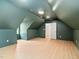 Spacious bonus room with angled ceilings and a doorway at 3281 Phillips Chapel Rd, Haw River, NC 27258