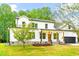 Charming two-story home with well-maintained lawn, stone accents, and a welcoming front porch at 3281 Phillips Chapel Rd, Haw River, NC 27258