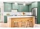 Kitchen boasting green cabinets, pendant lights, and a spacious island with quartz countertop at 3281 Phillips Chapel Rd, Haw River, NC 27258