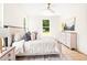 Light and airy bedroom featuring neutral tones, a ceiling fan, and large windows offering natural light at 3281 Phillips Chapel Rd, Haw River, NC 27258
