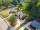 This aerial view captures the home's setting amongst lush greenery and neighborhood charm at 3425 Brentwood Rd, Raleigh, NC 27604