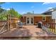 Enjoy outdoor dining on this wooden deck, featuring a dining set and grill at 3425 Brentwood Rd, Raleigh, NC 27604