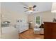 Adorable Bedroom featuring a crib, changing table, and a cozy chair with bright, natural light at 3425 Brentwood Rd, Raleigh, NC 27604