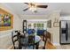 Dining area offers a view to the Gathering room with hardwood floors and neutral paint at 3425 Brentwood Rd, Raleigh, NC 27604