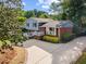 Charming two-story home with brick and siding, large driveway, and landscaped front yard at 3425 Brentwood Rd, Raleigh, NC 27604