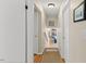 Hallway features hardwood floors and a view into the living room at 3425 Brentwood Rd, Raleigh, NC 27604