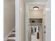 Bright hallway features stairs, storage, and a glimpse into the well-lit interior, creating a welcoming transition at 3425 Brentwood Rd, Raleigh, NC 27604