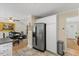 Cozy kitchen area features a stainless steel refrigerator and a view into the breakfast nook at 3425 Brentwood Rd, Raleigh, NC 27604