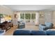 Inviting living room with large windows, comfortable armchairs, and plenty of natural light at 3425 Brentwood Rd, Raleigh, NC 27604