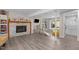 Finished basement area with fireplace, built in shelves, and walkout access at 3501 Arrowwood Dr, Raleigh, NC 27604