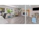 Finished basement featuring wood-look flooring, fireplace and large windows at 3501 Arrowwood Dr, Raleigh, NC 27604