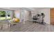 Finished basement with neutral walls, wood flooring, and ample space for various activities at 3501 Arrowwood Dr, Raleigh, NC 27604
