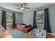 bedroom with a race car bed, ceiling fan and a play table with a train set at 3501 Arrowwood Dr, Raleigh, NC 27604