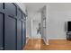 Inviting entryway with hardwood floors and a stylish coat rack, leading to a dining area at 3501 Arrowwood Dr, Raleigh, NC 27604
