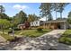 A charming home with a well-manicured lawn and convenient driveway at 3501 Arrowwood Dr, Raleigh, NC 27604