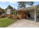 This brick home has a carport and lush landscaping at 3501 Arrowwood Dr, Raleigh, NC 27604