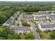 Aerial view of a cozy neighborhood with tree-lined streets, nearby pond, and convenient access to green spaces at 3508 Oneonta Ave, Raleigh, NC 27604