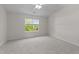 Serene bedroom with neutral tones, plush carpeting, and a window offering a peaceful view at 3508 Oneonta Ave, Raleigh, NC 27604