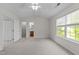 Bright bedroom featuring plush carpet, a window view, and ensuite bathroom and walk-in closet at 3508 Oneonta Ave, Raleigh, NC 27604
