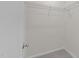 A walk-in closet with metal shelving and carpeted floor at 3508 Oneonta Ave, Raleigh, NC 27604