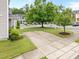 Driveway view featuring mature trees, a lush lawn, and a 'For Sale' sign at 3508 Oneonta Ave, Raleigh, NC 27604