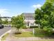Attractive townhome with manicured lawn, mature trees, and a welcoming front porch at 3508 Oneonta Ave, Raleigh, NC 27604