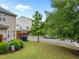 Side yard with grass and shrubs at 3508 Oneonta Ave, Raleigh, NC 27604