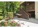 Backyard and patio area with flowers and built-in grill at 3612 Carriage Dr, Raleigh, NC 27612