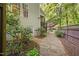 Charming home featuring a stone walkway, mature landscaping and a cozy outdoor space at 3612 Carriage Dr, Raleigh, NC 27612