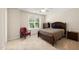 Comfortable bedroom with natural light, neutral colors, and a cozy chair at 3612 Carriage Dr, Raleigh, NC 27612