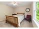 Cozy bedroom with a classic bed frame, comfortable bedding, and natural light at 3612 Carriage Dr, Raleigh, NC 27612