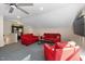 Spacious living room offers plenty of seating, TV, and beer sign at 3612 Carriage Dr, Raleigh, NC 27612