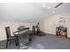 Bonus room featuring a game table, work out equipment, and Carolina Hurricanes decor at 3612 Carriage Dr, Raleigh, NC 27612