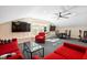 Open bonus room includes a lounge area, game table, and exercise equipment at 3612 Carriage Dr, Raleigh, NC 27612